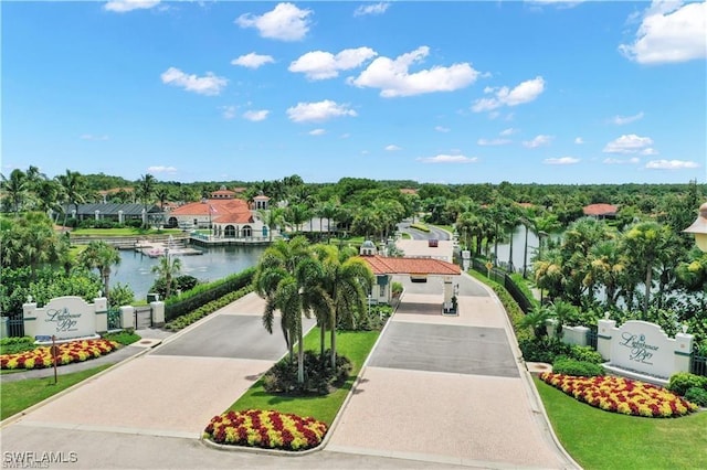 drone / aerial view with a residential view and a water view