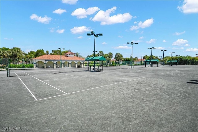 view of tennis court with fence