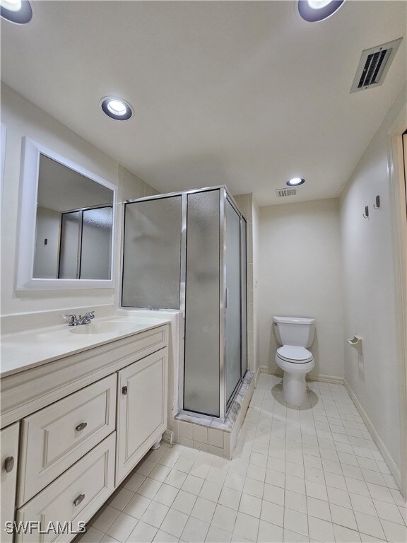 6025 Chardonnay Ln Unit 102, Naples, FL 34119 - full bathroom with tile patterned flooring, toilet, a shower stall, vanity, and recessed lighting
