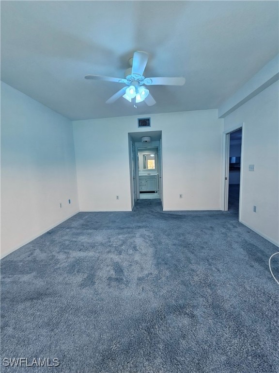 6025 Chardonnay Ln Unit 102, Naples, FL 34119 - empty room with a ceiling fan and carpet floors