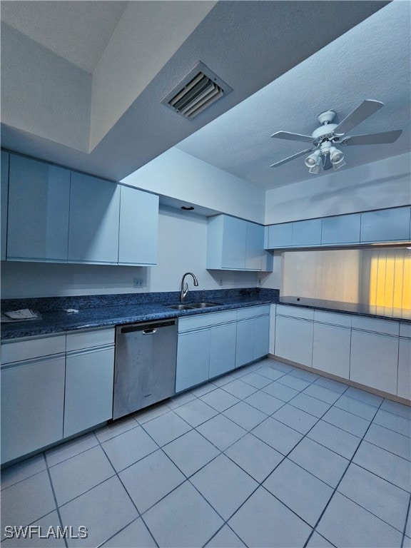 6025 Chardonnay Ln Unit 102, Naples, FL 34119 - kitchen featuring stainless steel dishwasher, white cabinets, light tile patterned floors, and a ceiling fan