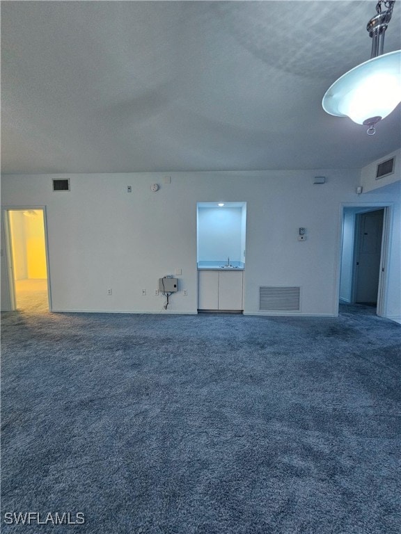 6025 Chardonnay Ln Unit 102, Naples, FL 34119 - unfurnished room featuring carpet flooring and a sink