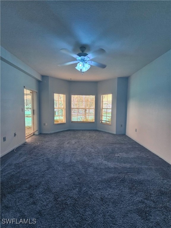 6025 Chardonnay Ln Unit 102, Naples, FL 34119 - carpeted empty room featuring a ceiling fan, plenty of natural light, and a textured ceiling