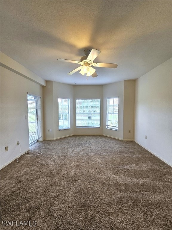 6025 Chardonnay Ln Unit 102, Naples, FL 34119 - spare room with ceiling fan, a textured ceiling, and carpet floors