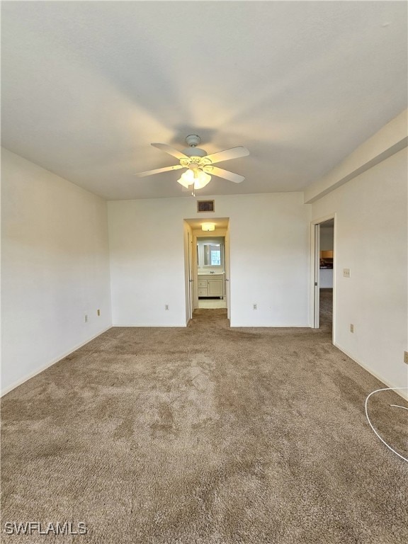 6025 Chardonnay Ln Unit 102, Naples, FL 34119 - carpeted empty room with a ceiling fan and baseboards
