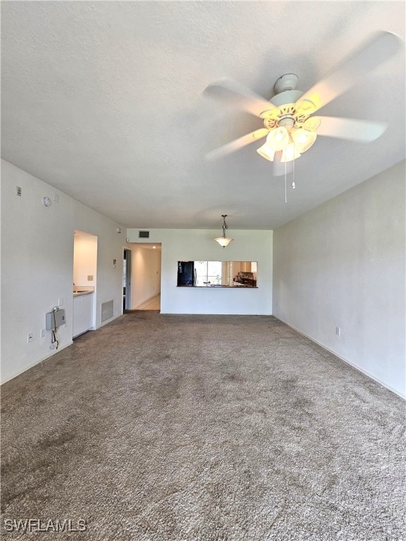 6025 Chardonnay Ln Unit 102, Naples, FL 34119 - unfurnished living room with a ceiling fan and carpet flooring