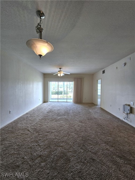 6025 Chardonnay Ln Unit 102, Naples, FL 34119 - spare room with carpet flooring, a textured ceiling, and ceiling fan