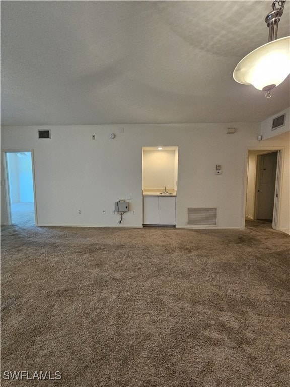 6025 Chardonnay Ln Unit 102, Naples, FL 34119 - unfurnished room with carpet flooring