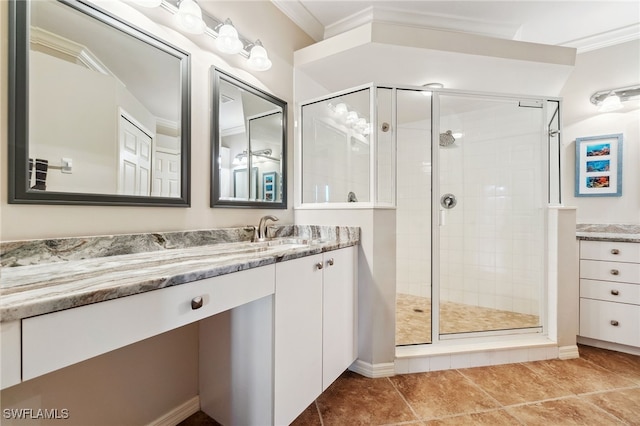 bathroom with vanity, crown molding, and a shower stall