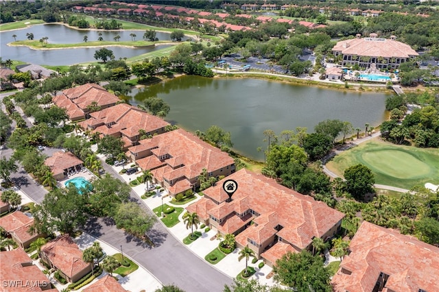 birds eye view of property with a residential view, view of golf course, and a water view
