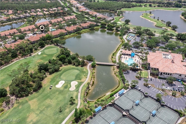 bird's eye view with a water view and view of golf course