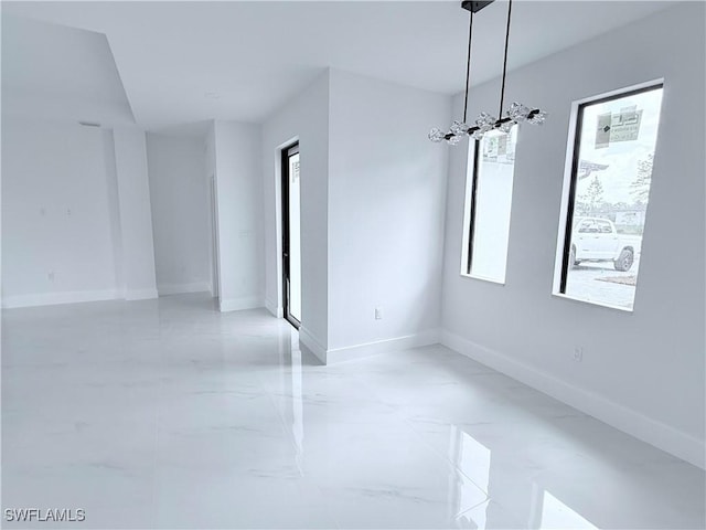 512 Genesee Ave S, Lehigh Acres, FL 33974 - spare room with baseboards and light marble finish flooring