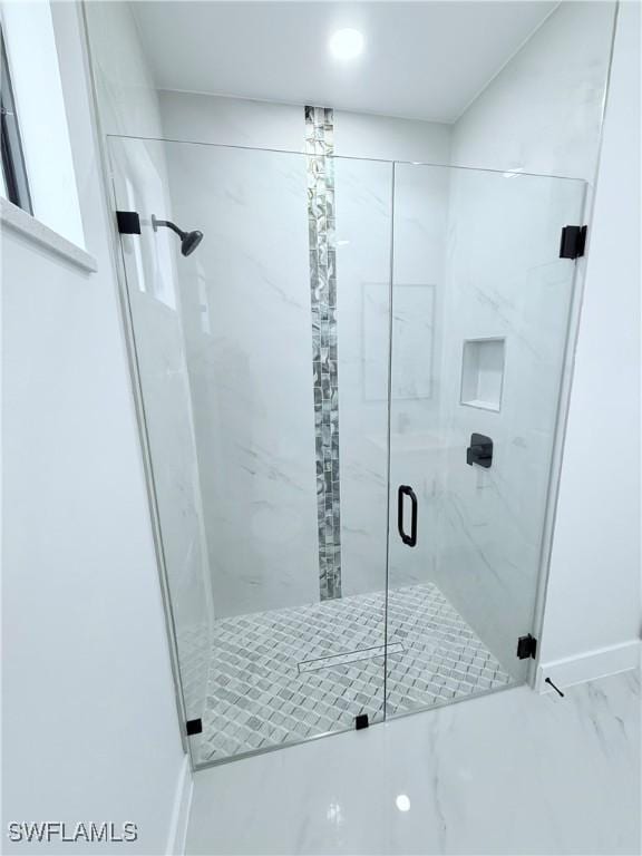 512 Genesee Ave S, Lehigh Acres, FL 33974 - full bathroom with a marble finish shower, marble look tiles, and baseboards