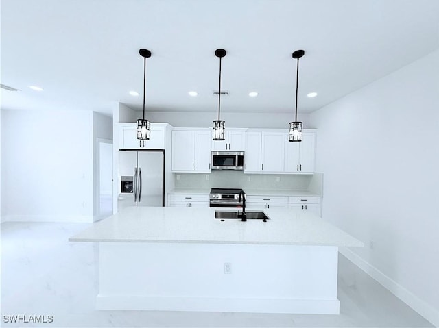 512 Genesee Ave S, Lehigh Acres, FL 33974 - kitchen featuring stainless steel appliances, baseboards, a sink, white cabinets, and recessed lighting