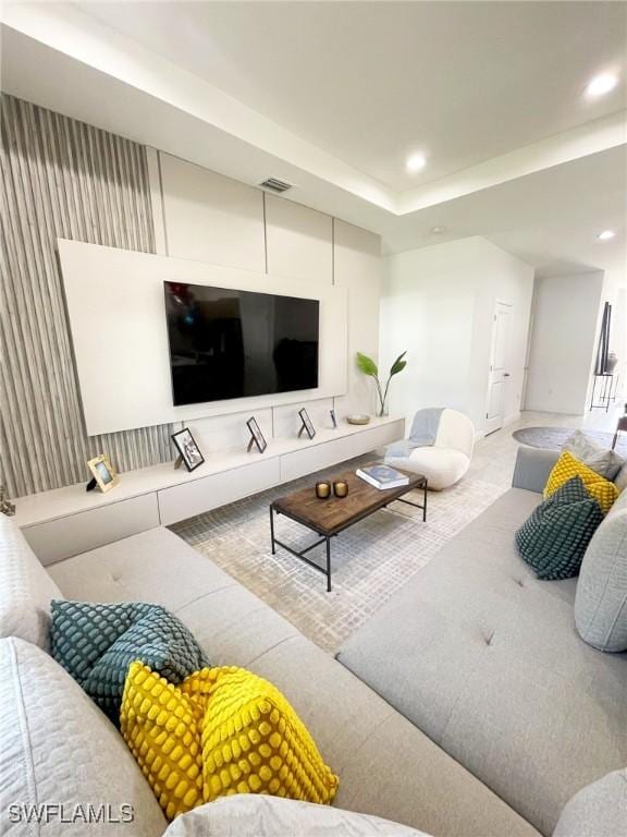 living room with baseboards, recessed lighting, and visible vents