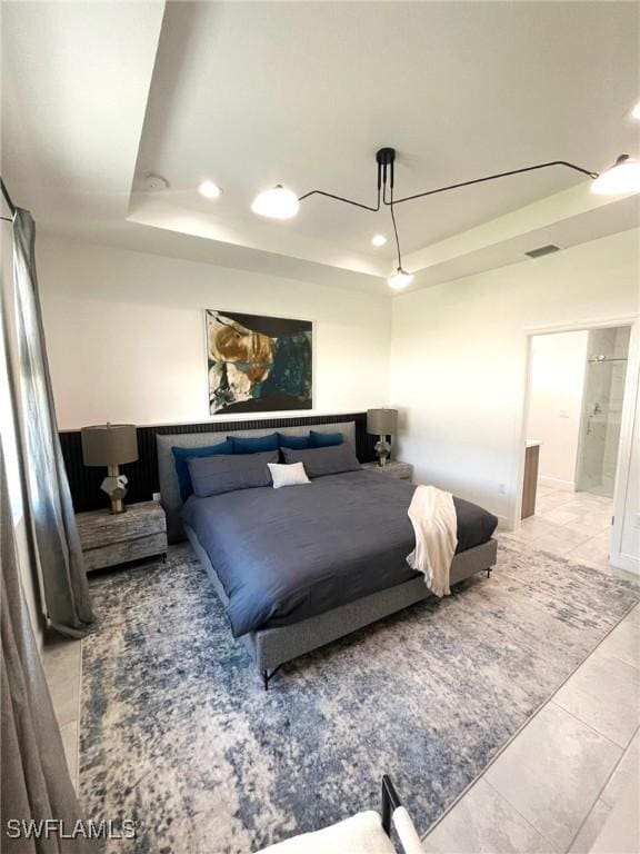 bedroom with recessed lighting, light tile patterned floors, a tray ceiling, and visible vents