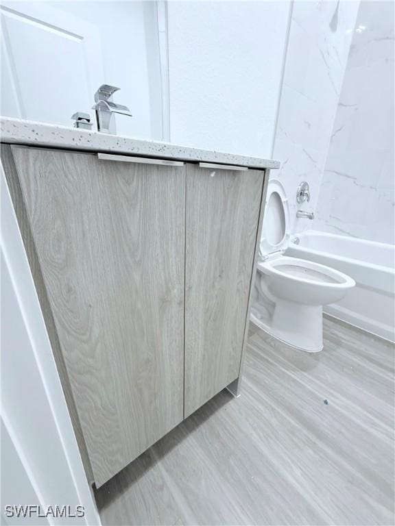 full bath featuring washtub / shower combination and toilet