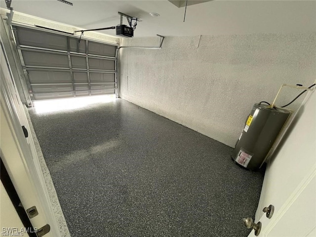 4709/4711 Leonard Blvd S, Lehigh Acres, FL 33973 - garage with water heater and a garage door opener