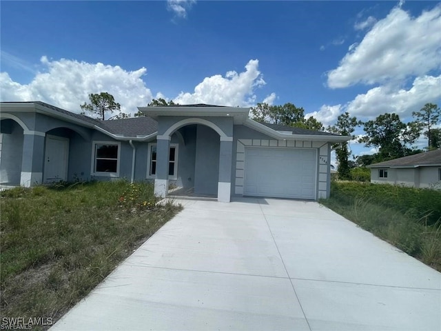 4709/4711 Leonard Blvd S, Lehigh Acres, FL 33973 - single story home with stucco siding, a garage, and concrete driveway