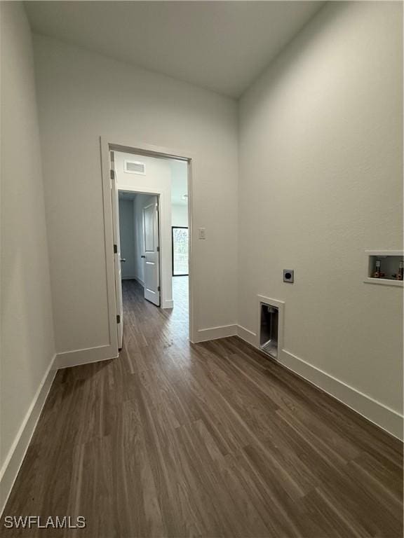 laundry area with laundry area, dark wood-style flooring, electric dryer hookup, baseboards, and hookup for a washing machine