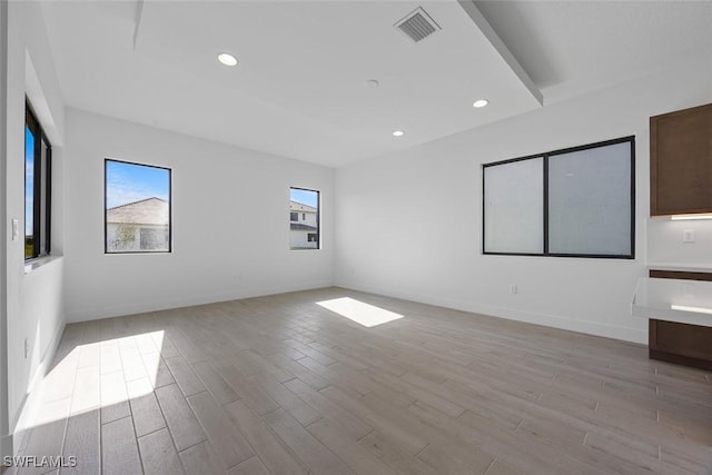 5243 Karlia Dr, Ave Maria, FL 34142 - spare room featuring recessed lighting, baseboards, light wood-type flooring, and visible vents