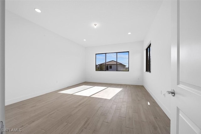 5243 Karlia Dr, Ave Maria, FL 34142 - spare room with baseboards, recessed lighting, and wood finished floors