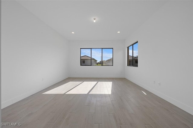 5243 Karlia Dr, Ave Maria, FL 34142 - empty room with recessed lighting, baseboards, and light wood finished floors