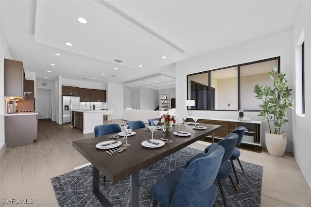 5243 Karlia Dr, Ave Maria, FL 34142 - dining area with light wood-style floors, recessed lighting, and visible vents
