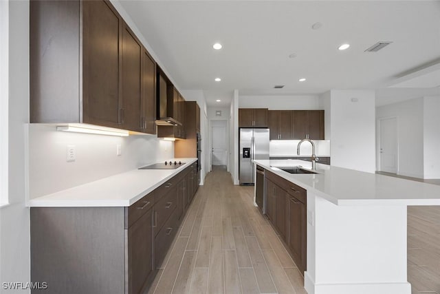 5243 Karlia Dr, Ave Maria, FL 34142 - kitchen featuring recessed lighting, a sink, light wood-style floors, and stainless steel appliances