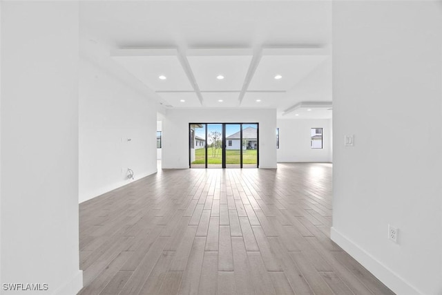5243 Karlia Dr, Ave Maria, FL 34142 - unfurnished living room with wood finished floors, beam ceiling, baseboards, recessed lighting, and coffered ceiling
