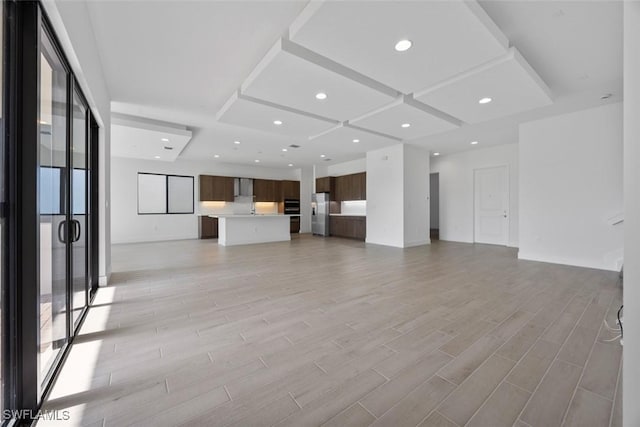 5243 Karlia Dr, Ave Maria, FL 34142 - unfurnished living room featuring light wood-style floors, recessed lighting, and coffered ceiling