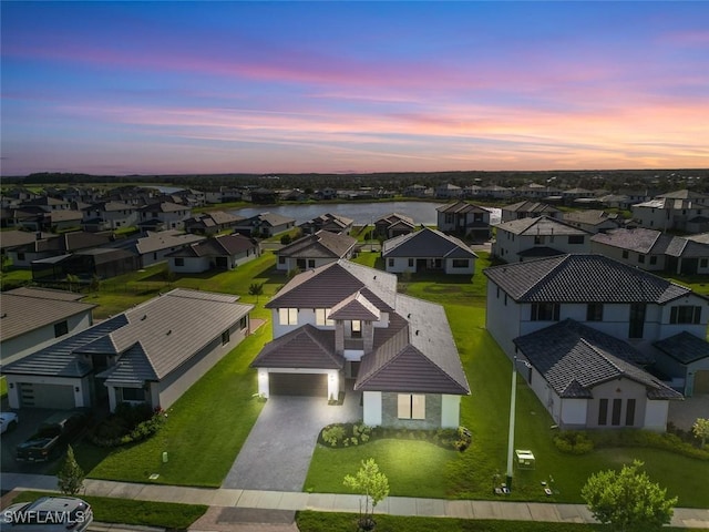 5243 Karlia Dr, Ave Maria, FL 34142 - aerial view at dusk with a residential view