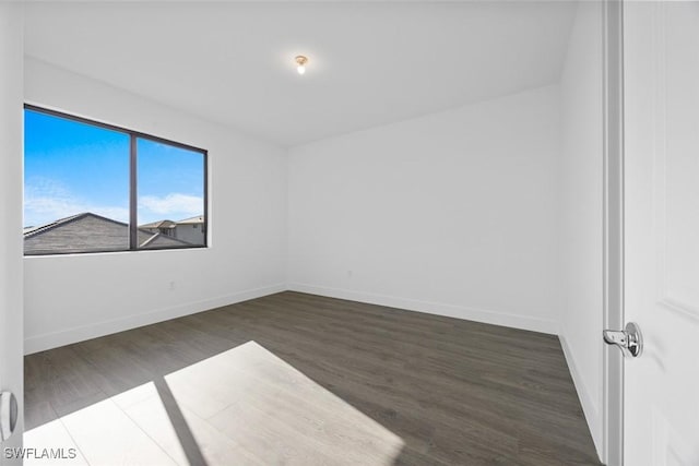 5243 Karlia Dr, Ave Maria, FL 34142 - unfurnished room with baseboards and wood finished floors