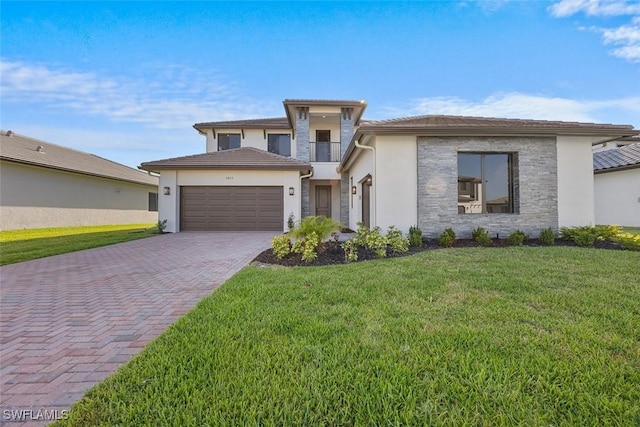 5243 Karlia Dr, Ave Maria, FL 34142 - prairie-style house with decorative driveway, a garage, stucco siding, and a front yard