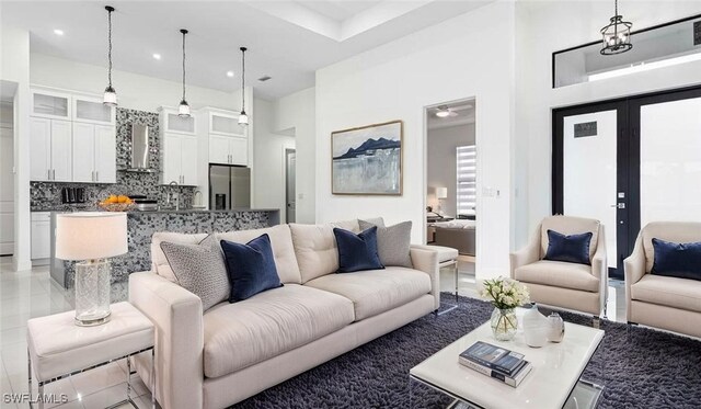 living room with recessed lighting and light tile patterned flooring