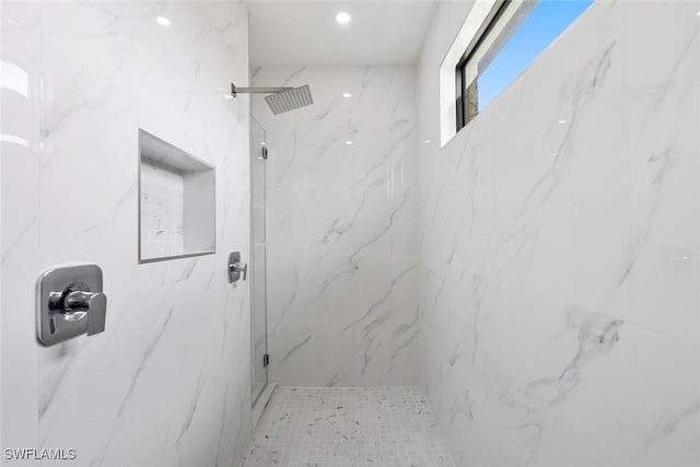 full bath with a marble finish shower