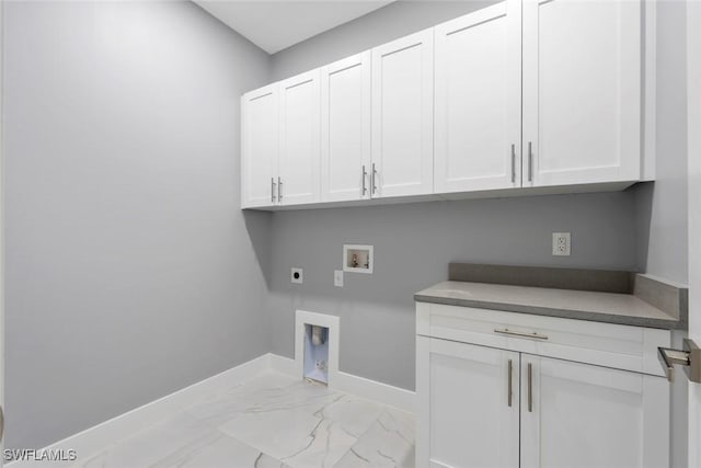 laundry area with electric dryer hookup, cabinet space, hookup for a washing machine, baseboards, and light marble finish flooring