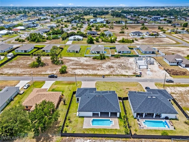 aerial view of residential area with a pool area