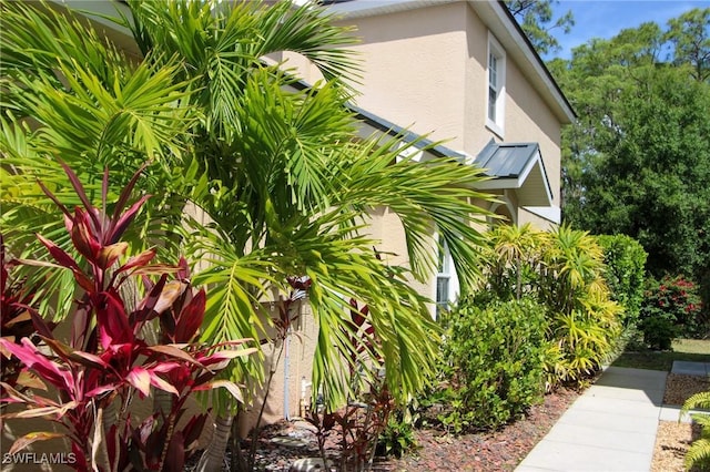 9792 Glen Heron Dr, Bonita Springs, FL 34135 - view of side of property with stucco siding