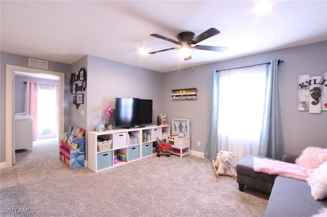 9792 Glen Heron Dr, Bonita Springs, FL 34135 - living room featuring ceiling fan, visible vents, baseboards, and carpet