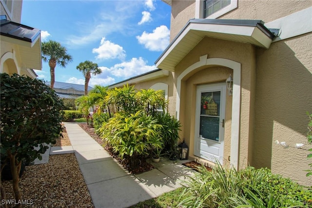 9792 Glen Heron Dr, Bonita Springs, FL 34135 - entrance to property featuring stucco siding