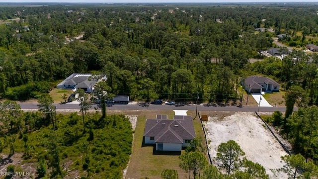 aerial overview of property's location featuring a forest