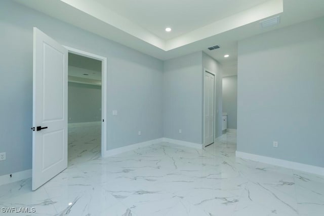 unfurnished bedroom with baseboards, recessed lighting, and light marble finish flooring