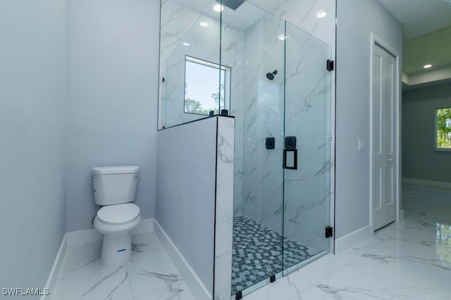 bathroom featuring baseboards, marble finish flooring, and recessed lighting