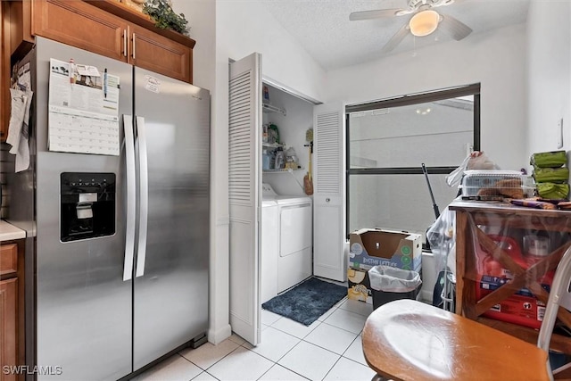 4732 Blackberry Dr, Fort Myers, FL 33905 - washroom with washing machine and clothes dryer, light tile patterned flooring, a ceiling fan, and a textured ceiling