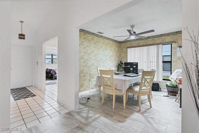 4732 Blackberry Dr, Fort Myers, FL 33905 - dining space with wallpapered walls, baseboards, a ceiling fan, and a textured ceiling