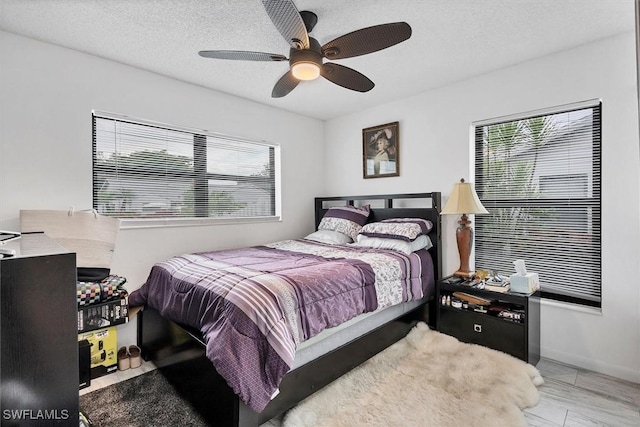 4732 Blackberry Dr, Fort Myers, FL 33905 - bedroom with multiple windows, a ceiling fan, and baseboards