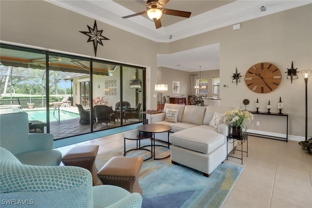 28404 Via Odanti Dr, Bonita Springs, FL 34135 - tiled living area with ornamental molding, ceiling fan, and a high ceiling