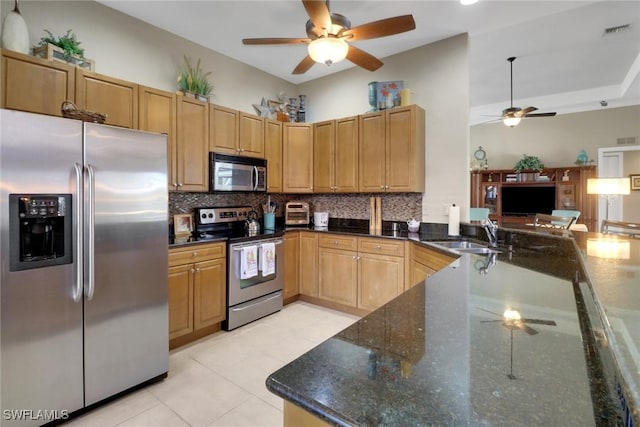 28404 Via Odanti Dr, Bonita Springs, FL 34135 - kitchen featuring a sink, stainless steel appliances, a ceiling fan, decorative backsplash, and visible vents
