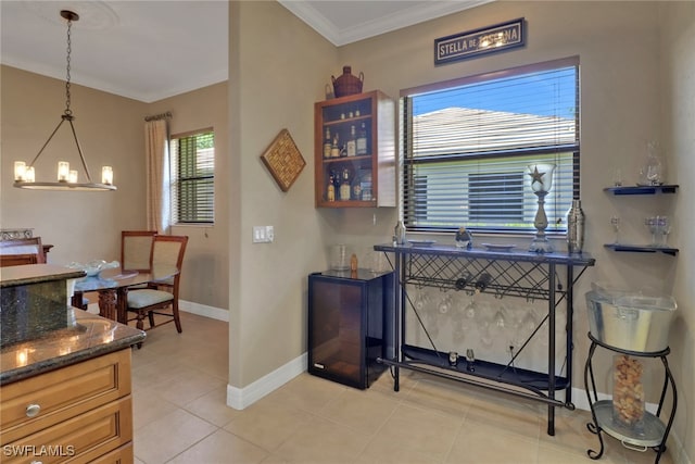 28404 Via Odanti Dr, Bonita Springs, FL 34135 - interior space with crown molding, baseboards, an inviting chandelier, and light tile patterned flooring